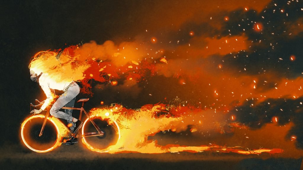 燃えながら自転車を漕ぐ男